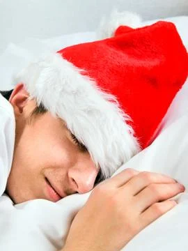 Man in Santa Hat sleeping Stock Photos