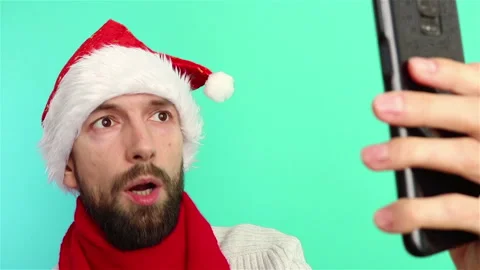 Man in santa hat using smartphone video call merry christmas and happy new year Stock Footage 143125968