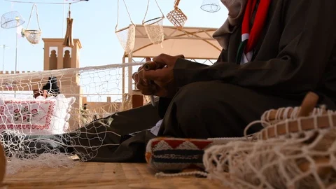 Man from Saudi Arabia doing handcraft work. He is preparing a fishnet. Stock Footage 103244710