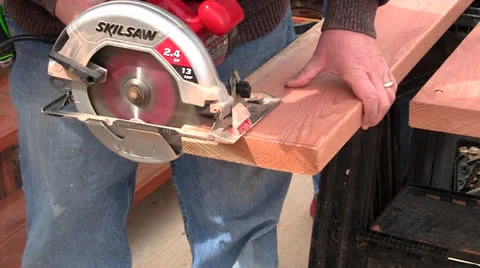 Man sawing board Stock Footage 22823335