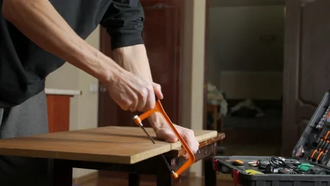 Man Sawing A Board Stock Footage 145013144