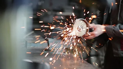 Man sawing metal by grinder, filmed with a slider Video stock 59641522