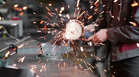 Man sawing metal by grinder, filmed with a slider 스톡 동영상 59641532