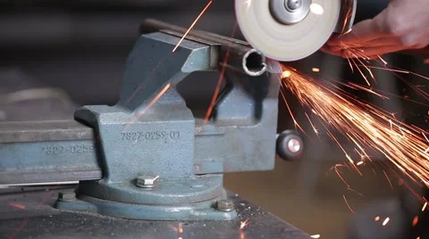 Man sawing metal by grinder, filmed with a slider Stock-Footage 59641578