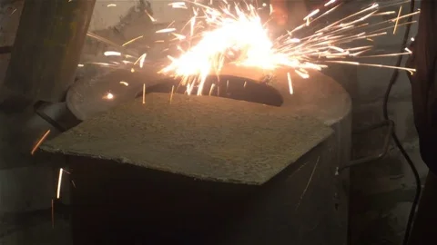 Man sawing metal by grinder, working environment Stock Footage 83322553