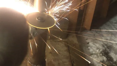 Man sawing metal by grinder, working environment 動画素材 83325333