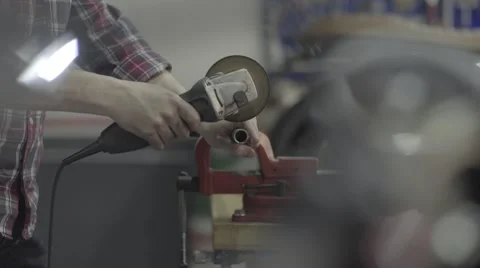 A Man Sawing a Metal Pipe Stock Footage 65197151