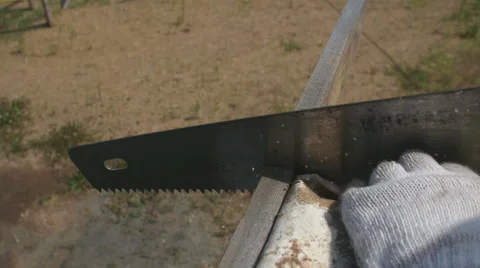A man sawing the plank 스톡 동영상 64777042