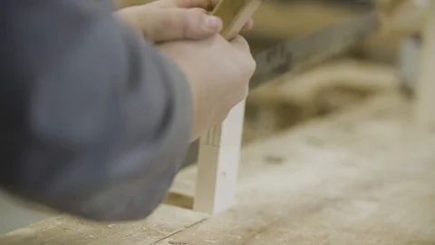 Man is sawing plank Stockbeeldmateriaal 92672042