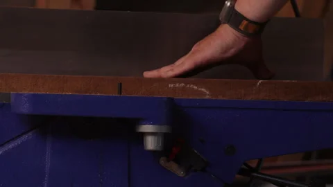 Man sawing wood on a jointer in a home workshop 스톡 동영상 281166409