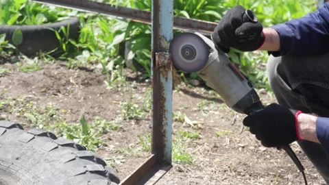 The Man Saws Angular Grinding Machine Iron Details of the fence. Video stock 130729923