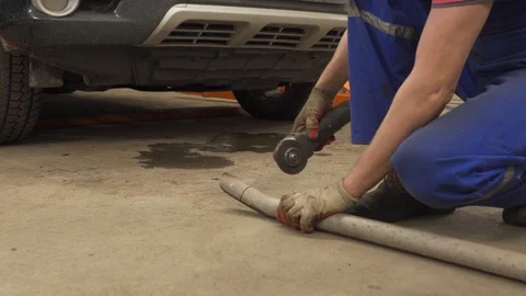 Man saws off the pipe Stock Footage 102868282