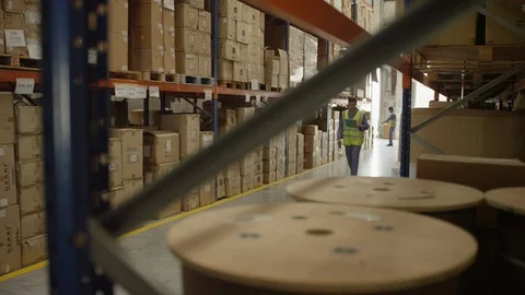 Man scanning box with barcode reader at warehouse. Stock Footage 119360263