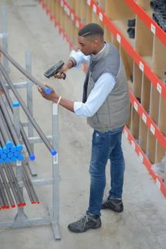 Man is scanning by handheld device Stock Photos