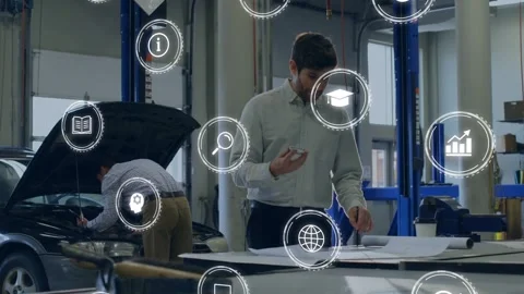 Man scanning plans on phone, spawning AR icons while auto tech repairing engine Stock Footage 332522887