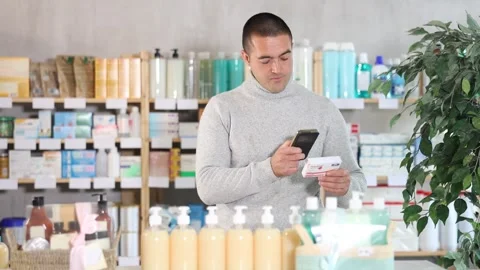Man scans code on package of paracetamol pills to check the expiration date Stock Footage 313097074