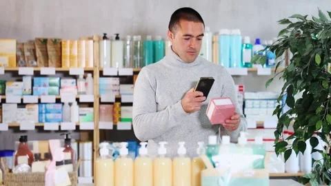 Man scans code on package of pills to check the expiration date Stock Footage 310067320
