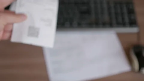 A man scans the QR code on a check from a supermarket. 스톡 동영상 100724930