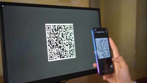 A man scans a QR code from the computer screen Stock Footage 123649142