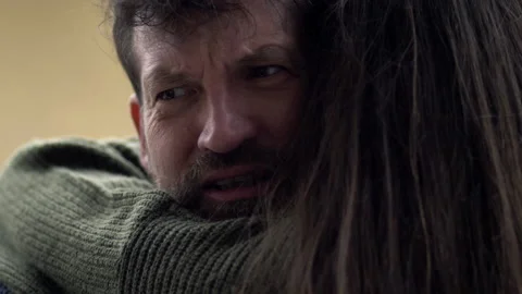 Man scared about the future hugging wife feeling pain and sorrow slow motion Stock Footage 130515470