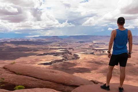 Man with scenic view of Split Mountain Canyon seen from Green River Overloo.. Stock Photos