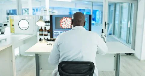 Man, scientist and computer in lab with back, virus and medical research for Stock Photos