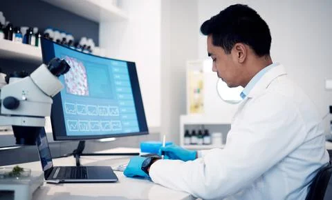 Man, scientist and computer with virus, bacteria and research data in laboratory Foto stock