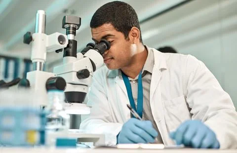 Man, scientist and microscope with clipboard in lab for research, medical r.. Stock Photos