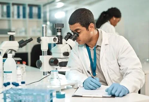 Man, scientist and microscope with document in lab for research, medical re.. Foto stock