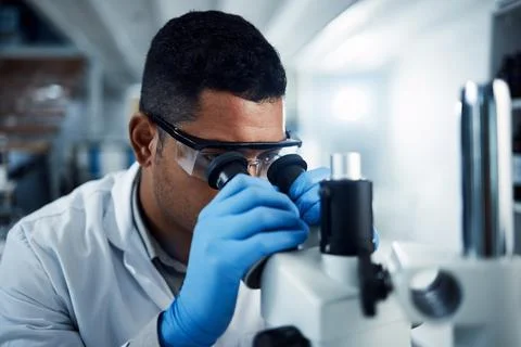 Man, scientist and microscope in forensic science research, discovery or data Stock Photos