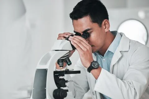 Man, scientist and microscope in forensic, research or new science discovery at Foto stock