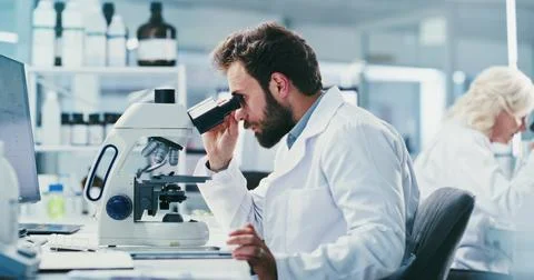 Man, scientist and microscope with study at lab for sample, medical researc.. Stock Photos