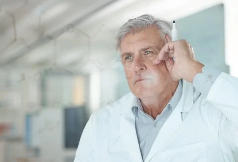 Man, scientist and thinking of formula on glass for problem solving, medical Stock Photos