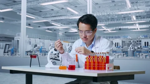 Man Scientist Carrying Out Experiments Analyzing Finding Sample Test Tube Stock Footage 269819583