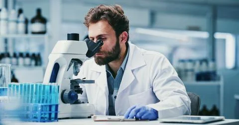 Man, scientist or exam with microscope in laboratory for medical research o.. Stock Photos
