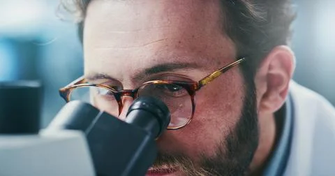 Man, scientist or investigation with microscope in laboratory for medical r.. Stock Photos