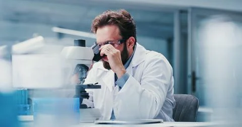 Man, scientist or microscope with glasses in laboratory for medical researc.. Stock Photos