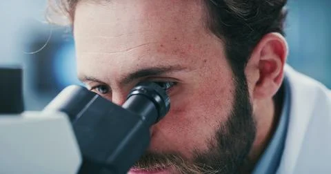 Man, scientist or research with microscope in laboratory for medical examin.. Stock Photos