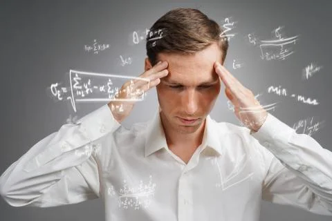 Man scientist or student working with various high school maths and science Stock Photos
