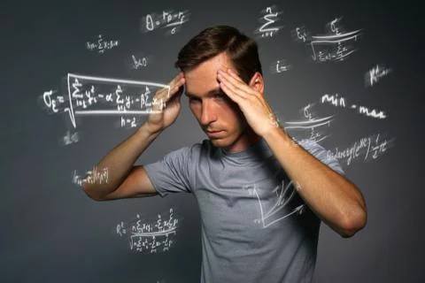 Man scientist or student working with various high school maths and science Stock Photos