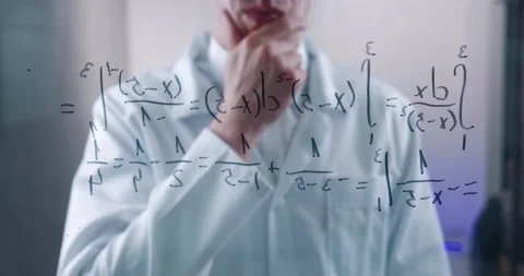 Man Scientist thinks over the solution of the integral equation, drawn on a Stock Footage 151548989