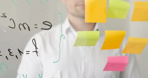 Man scientist is working with notes on sticks and formula on transparent screen. Stock Footage 129900309