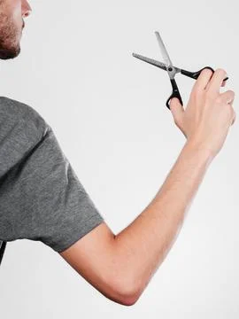 Man with scissors texturizing or thinning shears Stock Photos