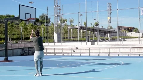 Man scoring basket from behind Stock Footage 64037956