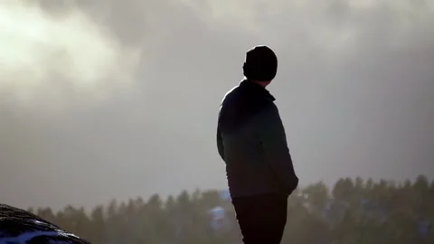 Man scouting on top of a mountain Stock Footage 233513923