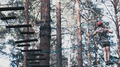 Man scrambles over an obstacle Stock Footage 73819707