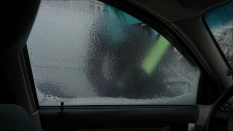 Man Scrapes Icy Car Window in Winter Chill Stock Footage 264757194