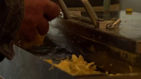 Man scraping wax from his machine   Stock Footage 74055885