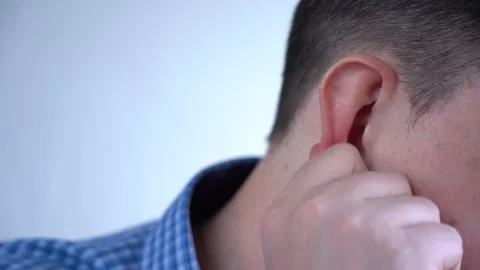Man Scratches His Ear. Close-up of the Neck and Ear. Stock Footage 150888884