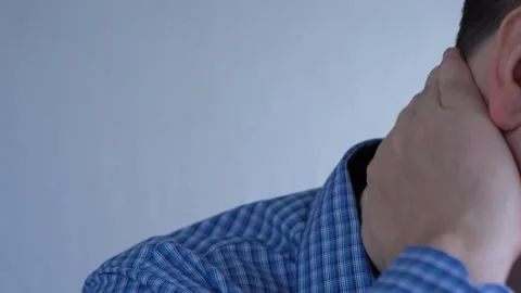 The man scratches his neck. Stock-Footage 165834545